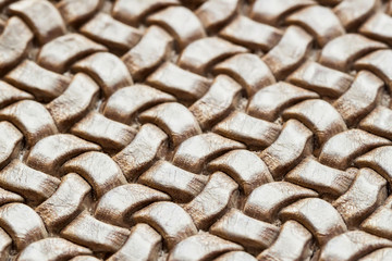 Genuine wicker leather texture, brown color, close-up.