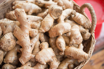 fresh ginger root in basket