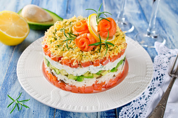 Layered salad with salmon, avocado and cream cheese