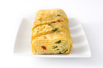 Traditional tamagoyaki Japanese omelette isolated on white background