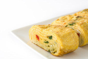 Traditional tamagoyaki Japanese omelette isolated on white background