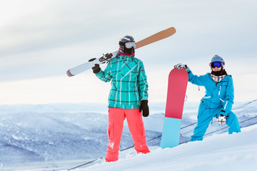 Couple skier snowboarder ski snowboarding concept