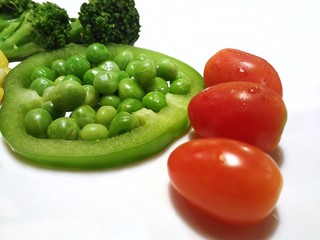 healthy eating food isolated, Grape tomatoes Broccoli Garden Pea Pisum sativum in slice of Bell pepper paprika