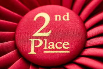 Close up of a fabric 2nd place red rosette