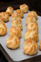 French dessert croquembouche. Wedding cake. New year dessert. Homemade eclairs filled with custard. Profiterole. 