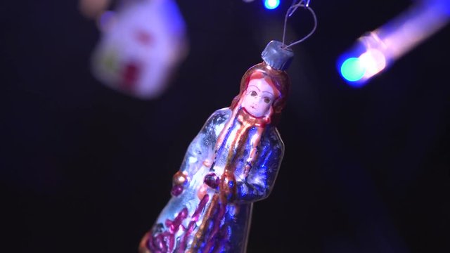 Christmas tree decorated with antique toys and garlands.