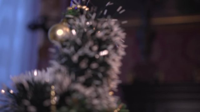 Christmas tree decorated with antique toys and garlands.