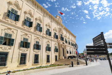 Fototapeta na wymiar Auberge de Castille building and direction signs in Valletta, Malta