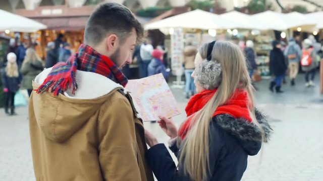 Couple looking on the map and quarrelling with each other, steadycam shot
