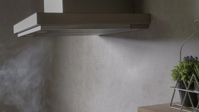 We can see a lot of steam coming out of the container where the spaghetti are cooking. The steam goes into the kitchen hood.
