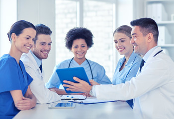 group of happy doctors meeting at hospital office