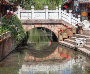 Ancient bridge in Dayan old town. Lijiang, China.