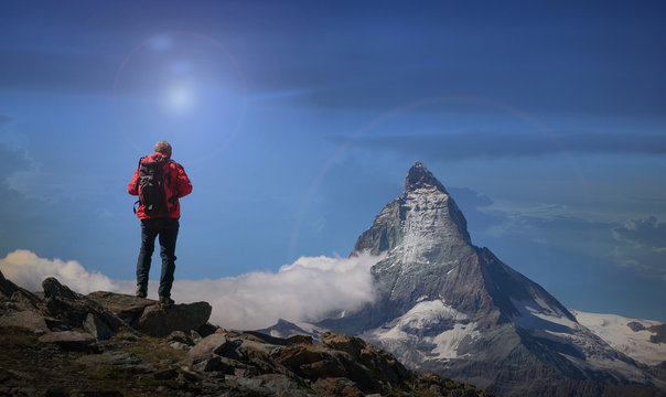 Rear view of senior male climber looking out at Matterhorn, Canton Wallis, Switzerland