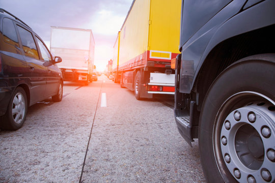 Low angle view of rows of traffic queueing on highway