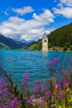 Submerged Curon church bell tower in lake, Vinschgau Valley, South Tyrol, Italy