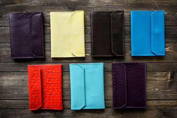 Group colorful Wallet of Leather skin on wooden background