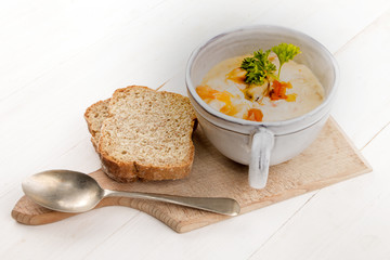 scottish fish soup in a cup and two slices of soda bread