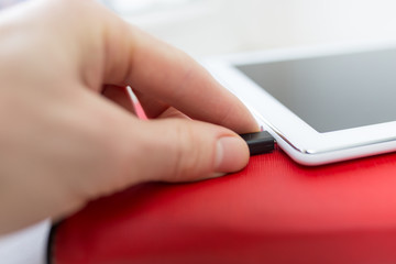 Fototapeta premium Close-up plugging in USB charging or data cable