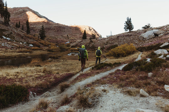 Rear View Of Two Male Hikers Hiking Up Rugged Landscape, Mineral King, Sequoia National Park, California, USA