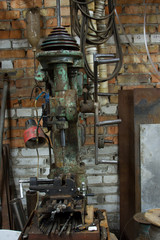 Fototapeta na wymiar Old and dirty drilling machine in factory