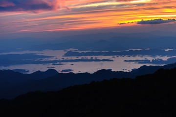 Beautiful freshwater lagoon with mountains island at sunset.