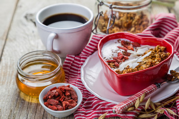 Valentine's day breakfast - granola with yogurt, goji berries and coconut