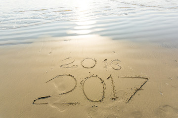 Numbers 2017 on beach wave, Newyear concept