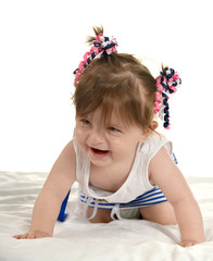 Baby girl lying on  blanket