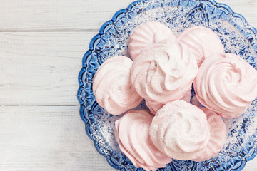 Obraz na płótnie Canvas Strawberry marshmallows on a white background, horizontal, soft focus