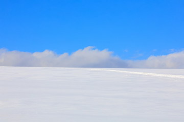 Simple winter background with blue sky