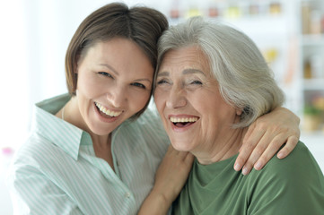 senior mother with adult daughter