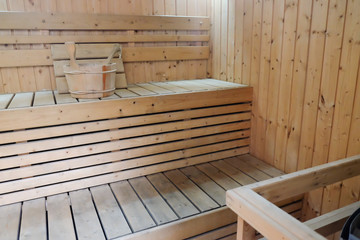 Wooden sauna with stone oven