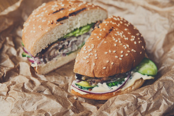 Classic american burgers, fast food on wood background