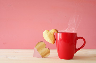 Cup of coffe and heart shape cookies