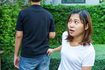 Female pickpocket stealing a wallet from behind pocket on jeans