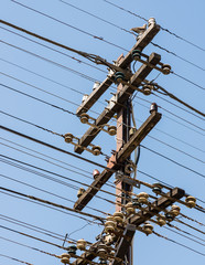 Old telegraph pole with complex wire.