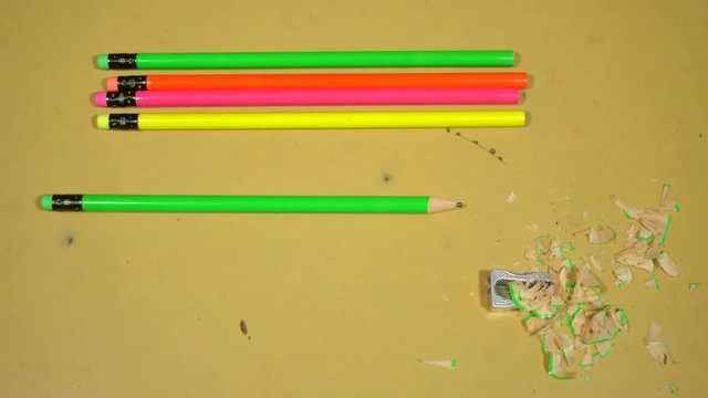 4K Stop motion animation of sharpener sharpening one of the pencils