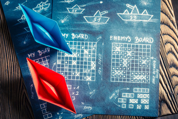 Vintage battleship paper game as a battle concept