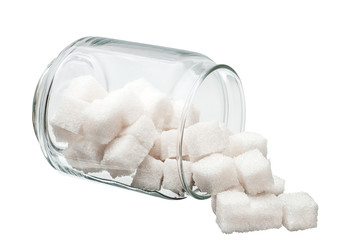 White lump sugar in a glass jar.