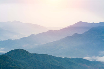Naklejka premium Mountain view on morning with fog,Fog on the Mountain