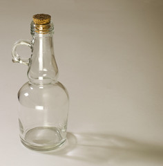 Empty glass bottle on white background