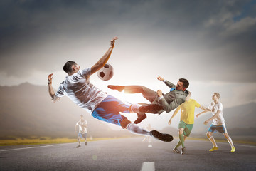 Fototapeta na wymiar Soccer player kicking ball . Mixed media
