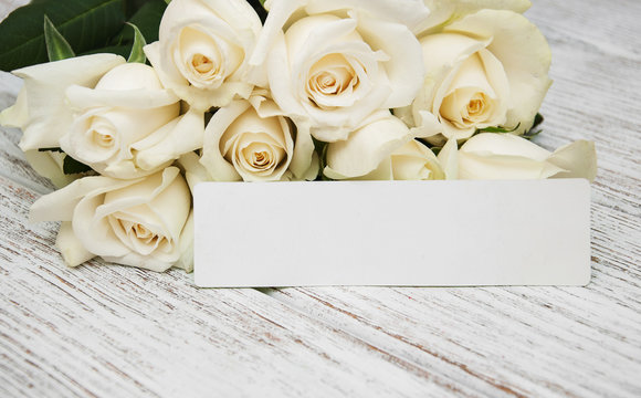 White roses with tag