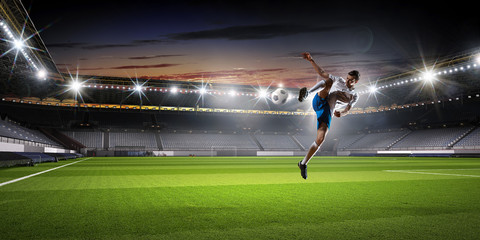 Soccer player at sport arena . Mixed media