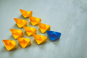 Leadership concept with paper boats