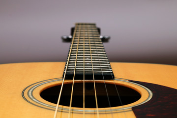 Part of a wooden acoustic guitar