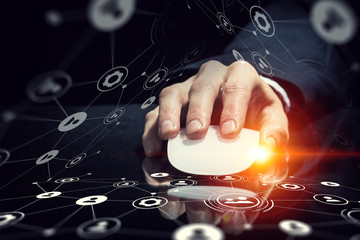 Businessman using mouse . Mixed media