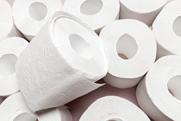 Toilet paper on pink background