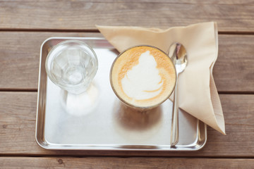 Hot coffee on wood table vintage tone