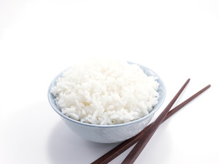 Rice in a bowl with chopsticks isolated